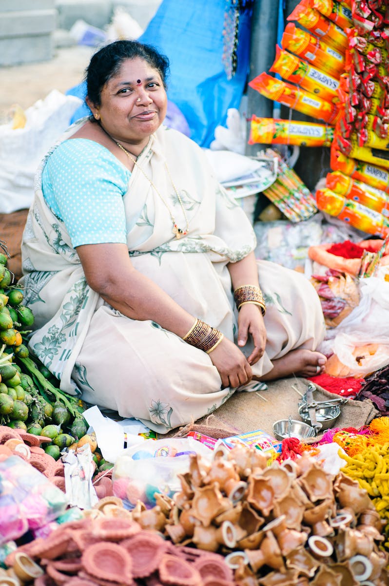 Woman Sitting Outdoor Selling Souvenirs
